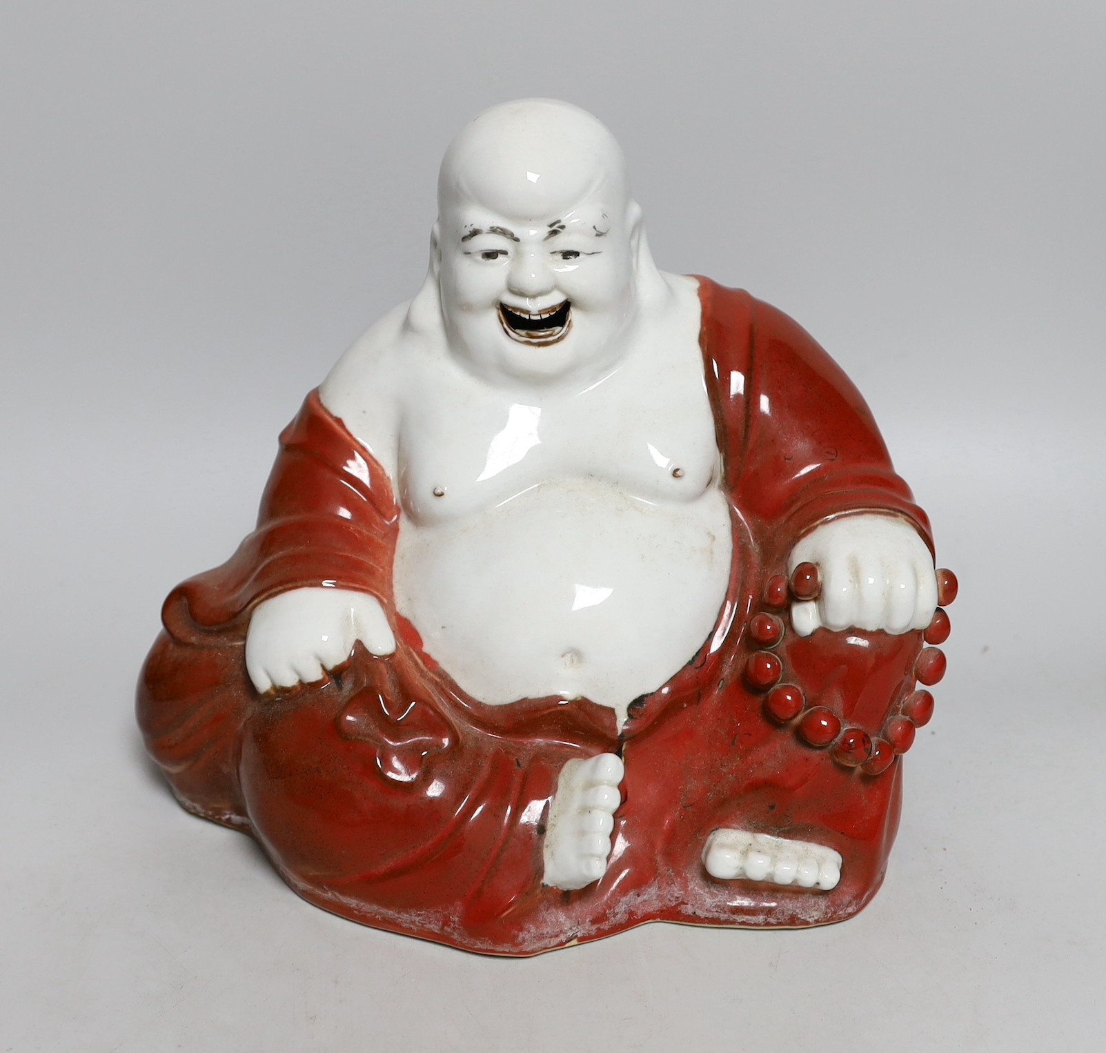 A Chinese enamelled porcelain figure of Budai, Republic period, 24cms high